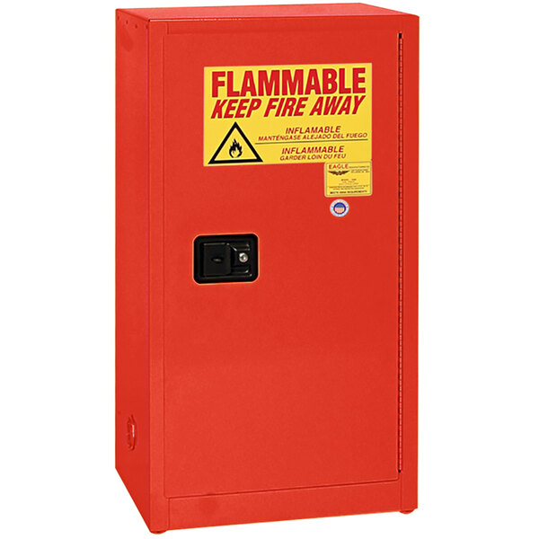 A red Eagle Manufacturing safety cabinet with a yellow warning label.