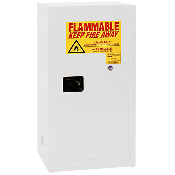 A white Eagle Manufacturing safety cabinet with a yellow sign reading "Flammable Liquid"