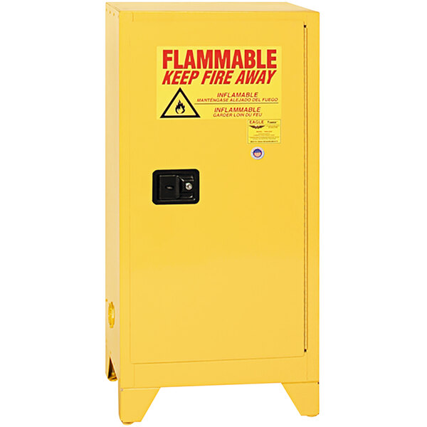 A yellow Eagle Manufacturing safety cabinet for flammable liquids with legs and a warning sign.