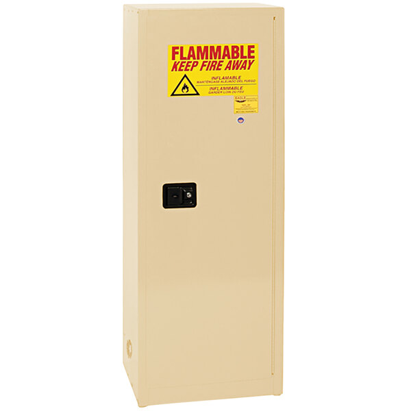 An Eagle Manufacturing beige safety cabinet with a yellow warning sign.