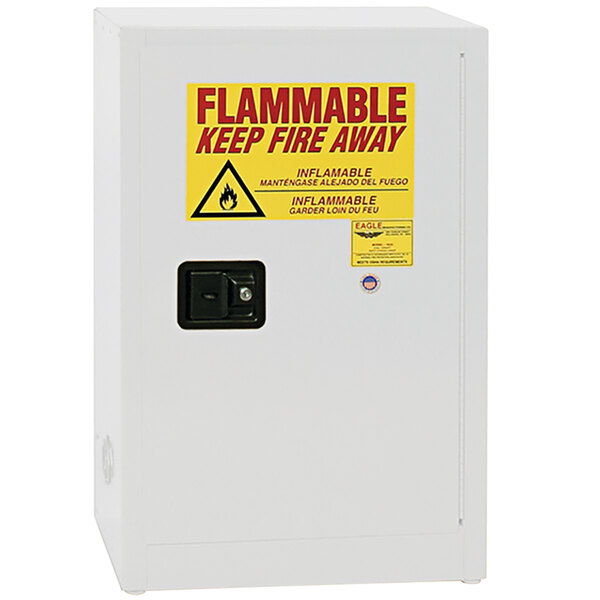A white rectangular box with a yellow sign reading "Flammable Liquid Safety" and "Eagle" in red text.