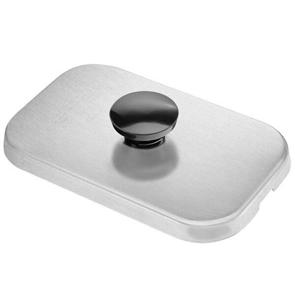 A silver rectangular stainless steel plate with a black knob.