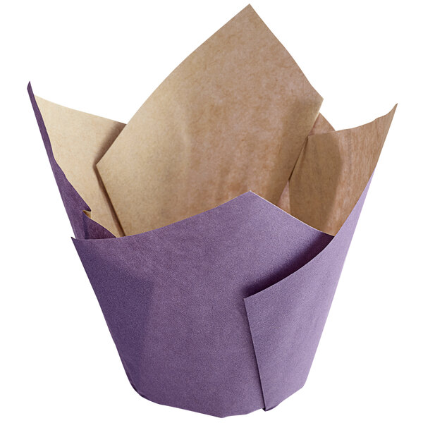 A purple paper tulip baking cup with a tan paper interior.