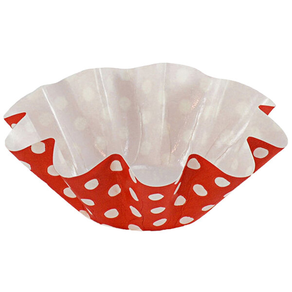 A red paper cupcake liner with white polka dots.