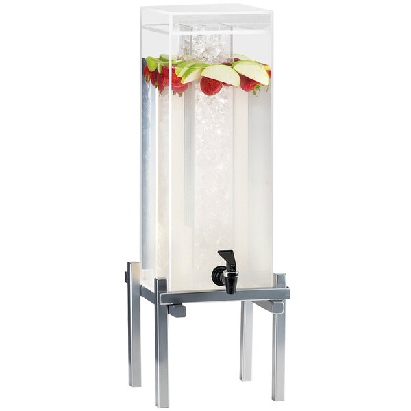 A Cal-Mil silver plastic beverage dispenser with ice and fruit in it.