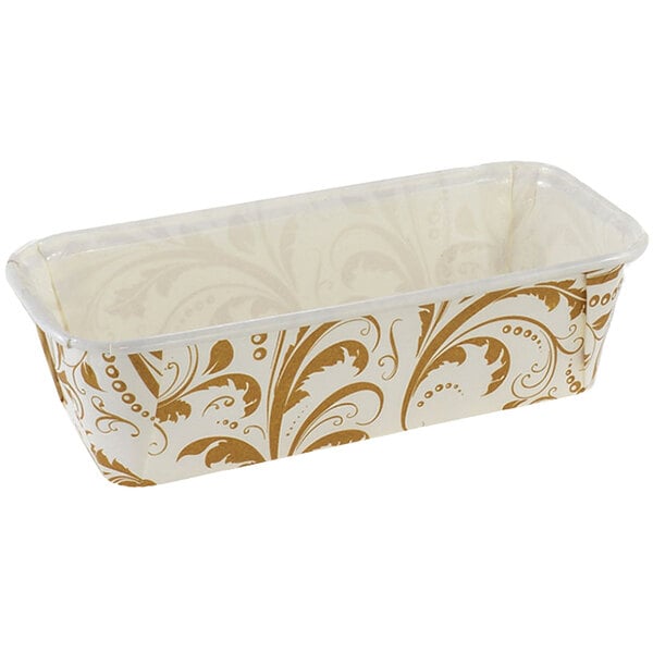 A rectangular Novacart loaf mold with gold and white designs.