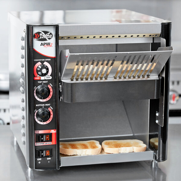 An APW Wyott conveyor toaster with two slices of bread toasting.