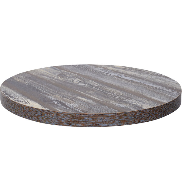 A BFM Seating Relic round wooden table top with a gray and white finish.