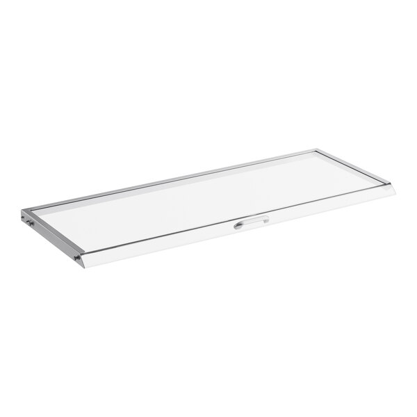 A clear rectangular lid with a metal handle.