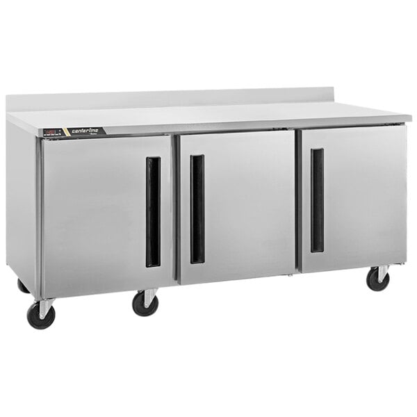 A large stainless steel Traulsen worktop freezer with right hinged doors.