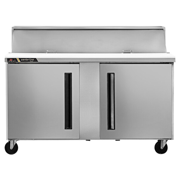 A silver Traulsen refrigerated counter with two right hinged doors.