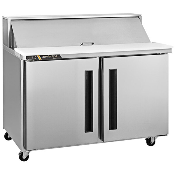 A silver Traulsen refrigerated sandwich prep table with 2 left hinged doors.