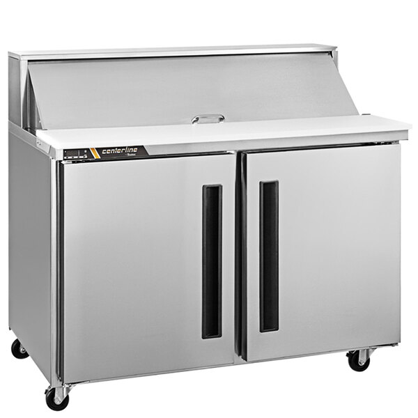 A silver Traulsen refrigerated sandwich prep table on a counter.