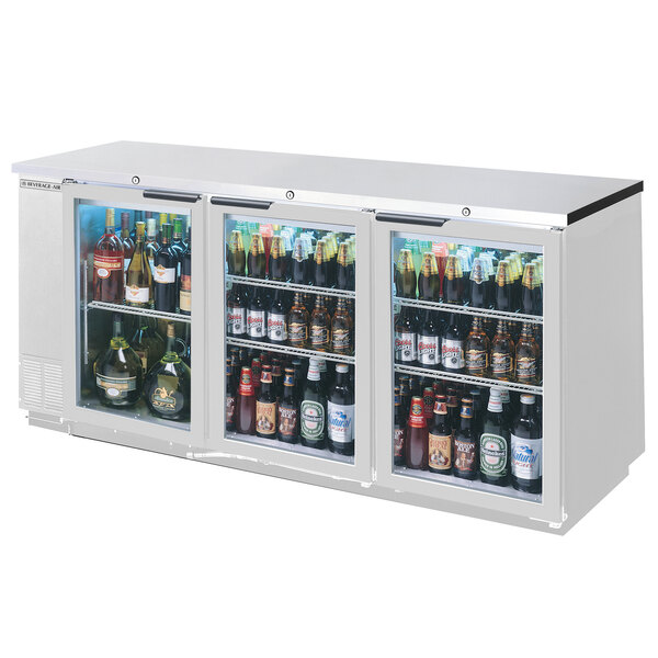 A Beverage-Air stainless steel back bar refrigerator with glass doors filled with bottles of beer.