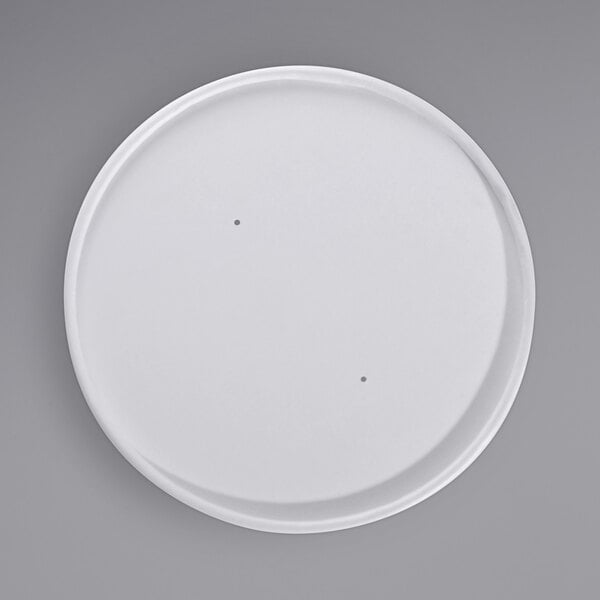 A white paper lid with a round edge and a hole in the middle.