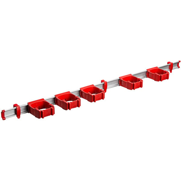 A white Toolflex One tool rack with red tool holders.
