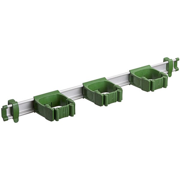 A green plastic Toolflex rack with three green plastic Toolflex holders.