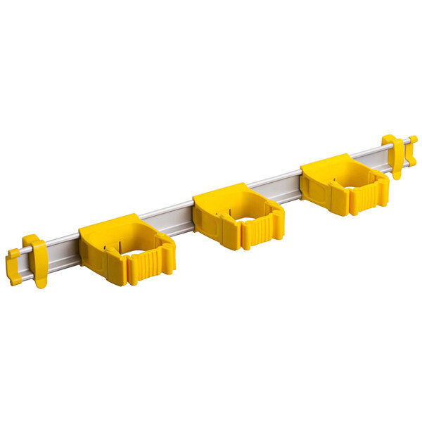 A white Toolflex rack with three yellow plastic holders.