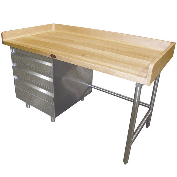 A wood workbench with a galvanized metal drawer unit.