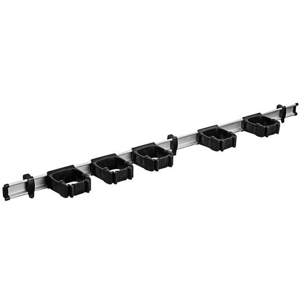 A white Toolflex rack with black plastic Toolflex holders.