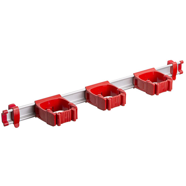 A red Toolflex rack with three red plastic tool holders.