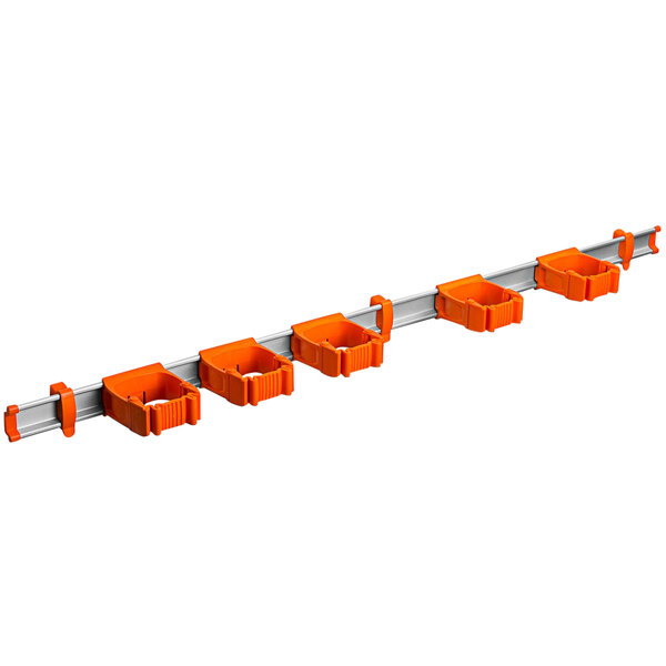 A white Toolflex rack with orange and grey tool holders.