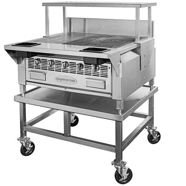 A large stainless steel Champion Tuff countertop charbroiler with 2 wood chip drawers.
