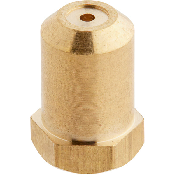 A gold metal nut with a hole threaded into a brass object.