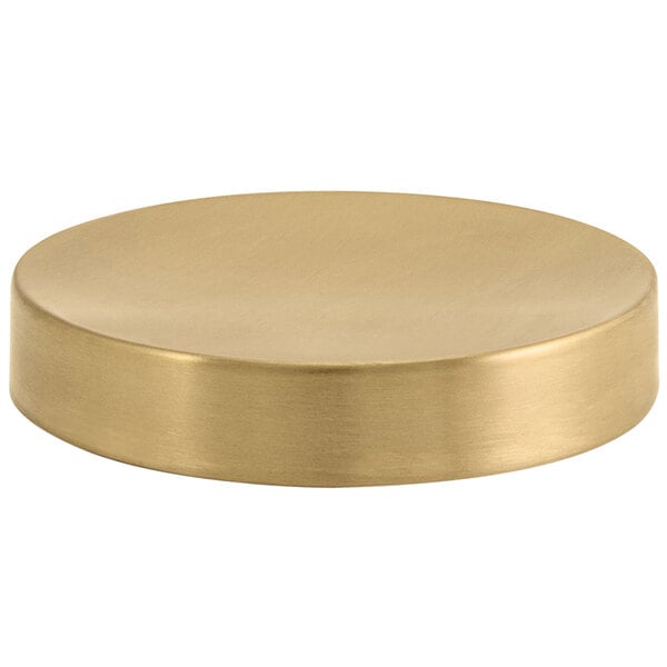 A Room360 matte brass round plate with a brushed stainless steel finish.