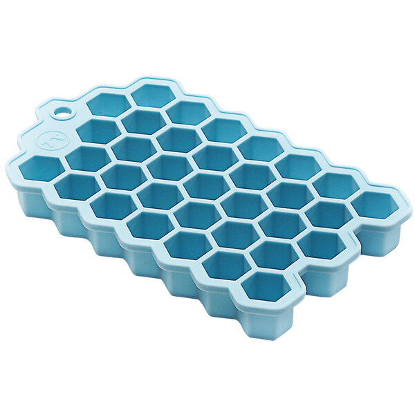 A blue Outset hexagon ice mold on a counter.