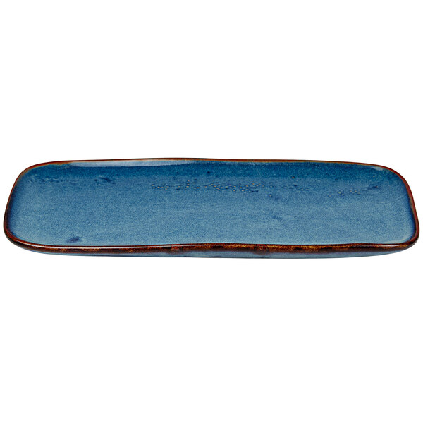 A blue rectangular porcelain platter with a brown border.
