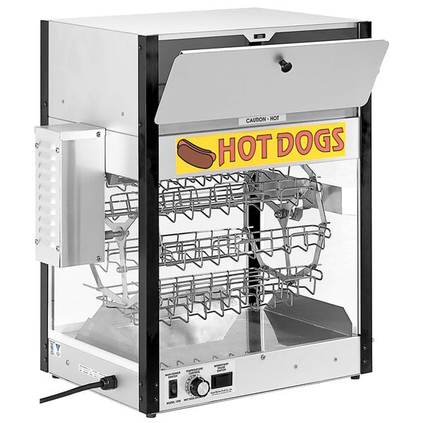 A Cretors hot dog machine with hot dogs and buns cooking.