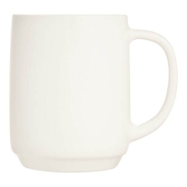 An ivory Arcoroc Zenix glass mug with a white handle.