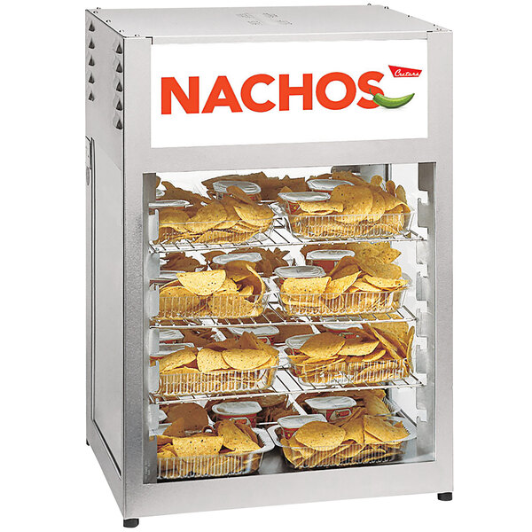A Cretors nacho chip warmer holding trays of nachos and chips.