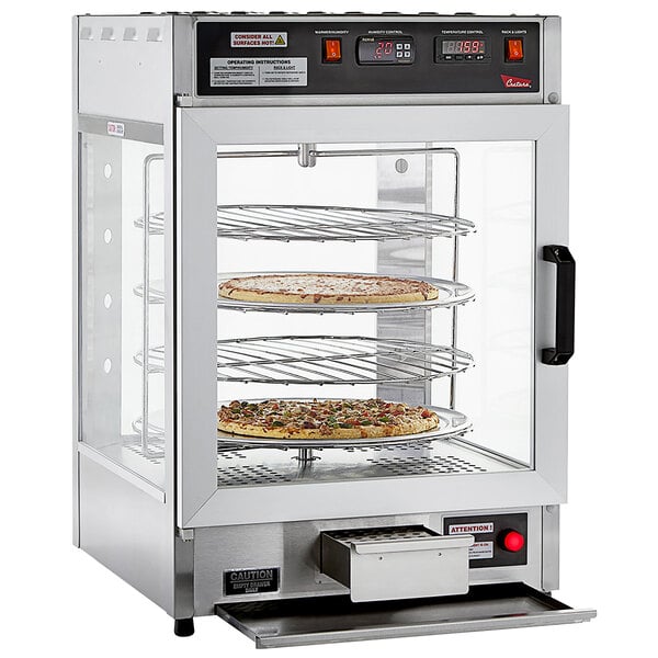 A Cretors humidified pizza warmer with a glass door holding a pizza.