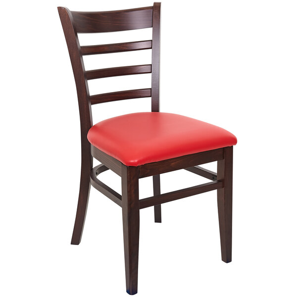 A BFM Seating Berkeley beechwood restaurant chair with a red vinyl seat and ladder back.