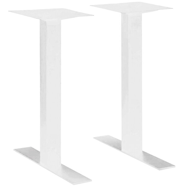 A pair of white metal rectangular column table bases.