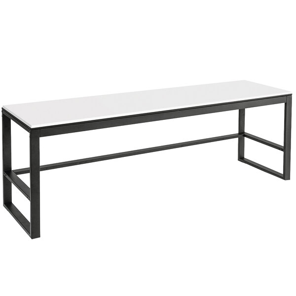 A white table with black legs.