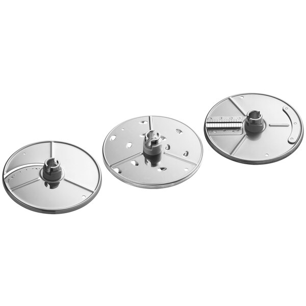 A group of silver circular metal discs with holes.