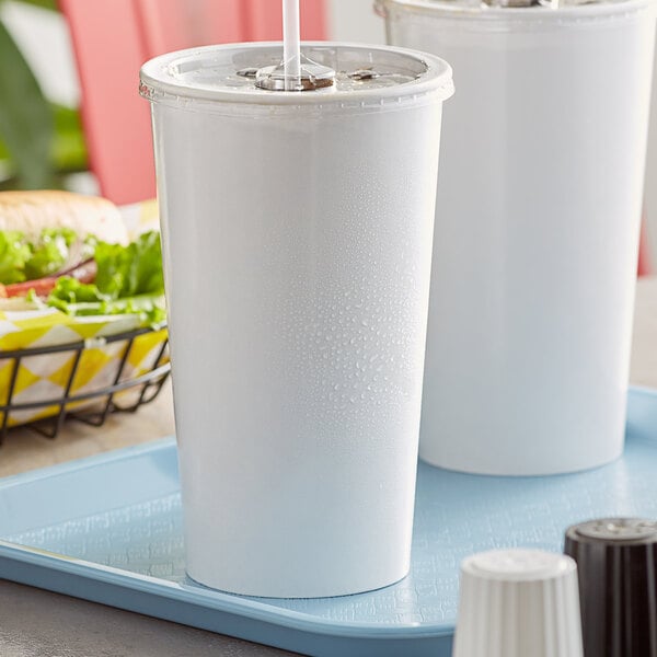 Two white Choice paper cold cups with straws on a tray.