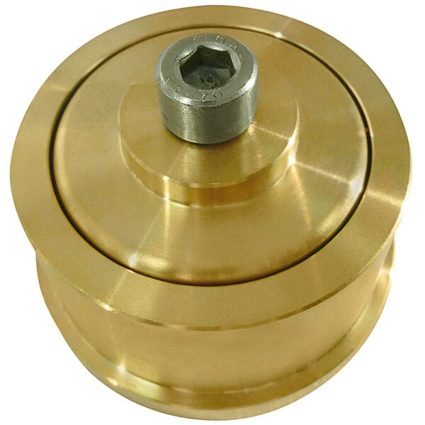 A close-up of a gold metal cylinder with a brass metal wheel and a nut on it.