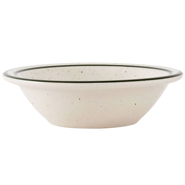 A white Tuxton china monkey dish with a green speckled rim.