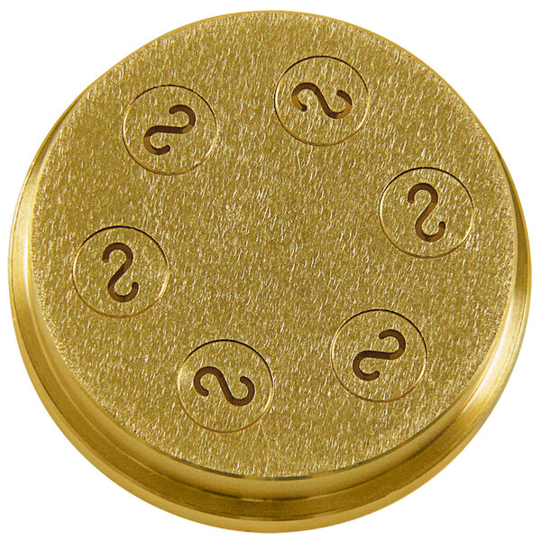 A gold circular brass die with black writing reading "Sirman 28180220 #220 Caserecce Pasta Die" on it.