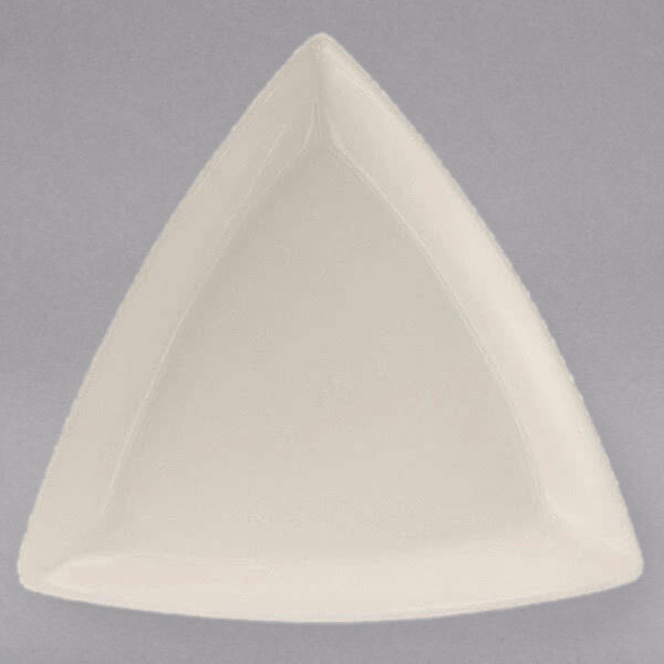 A white triangle shaped Tuxton china plate with a white rim.