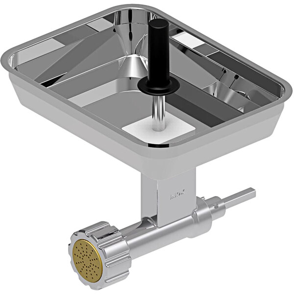 A Sirman i2 pasta extruder attachment in a metal bowl on a counter.