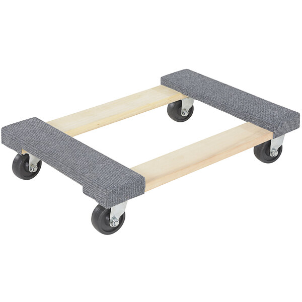 A wooden platform with black carpeted ends and black wheels.