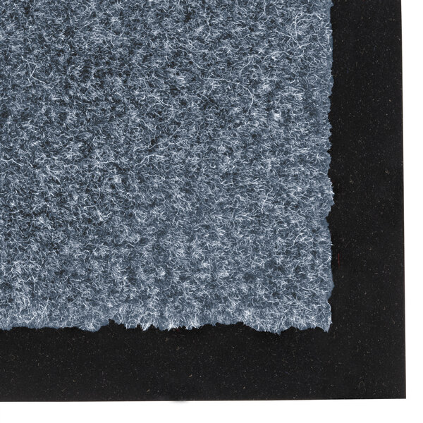 A slate blue carpet with a blue border.