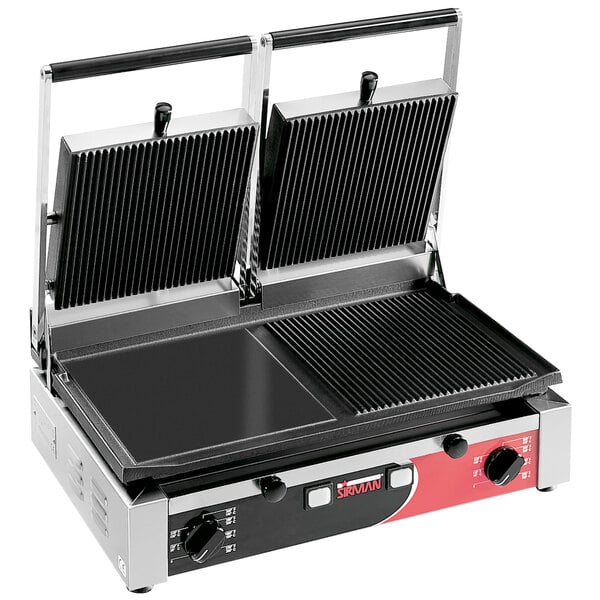 A Sirman double panini grill with grooved and smooth plates on a table in a professional kitchen.