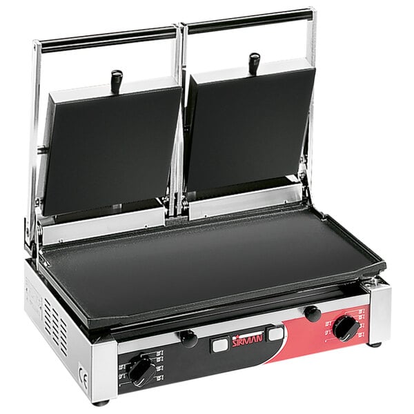 A Sirman double panini grill with smooth plates on a table.