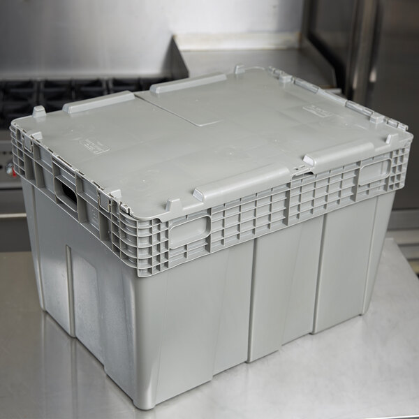 A grey plastic Vollrath Tote 'N Store chafer box on a counter.